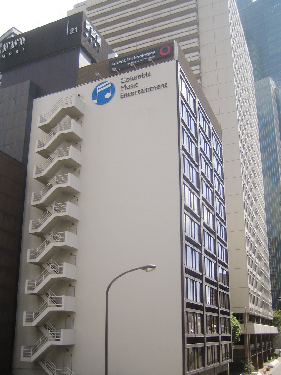 The company's Roppongi head office, photographed under the name it traded as from October 2002 to September 2010 - Columbia Music Entertainment, whose blue note-mark is on the facade. The Malice Mizer disc here was released six months before that rename, and the company has since moved to Jingūmae M-SQUARE.